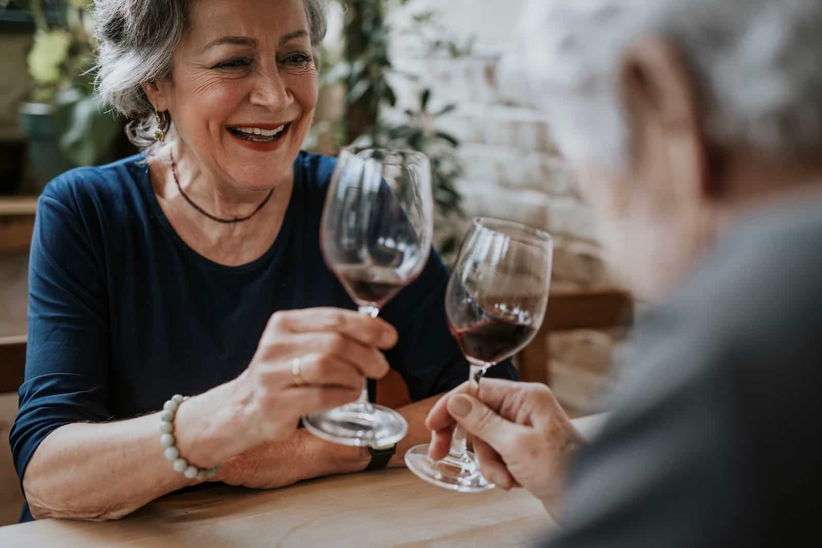 A couple enjoying dinner and wine at one of the best Deep Creek Lake restaurants