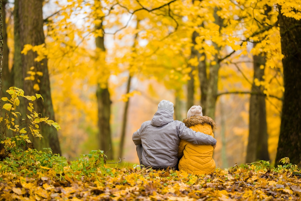 things to do near our Deep Creek Lake Hotel, a couple enjoying the bright fall colors in Maryland