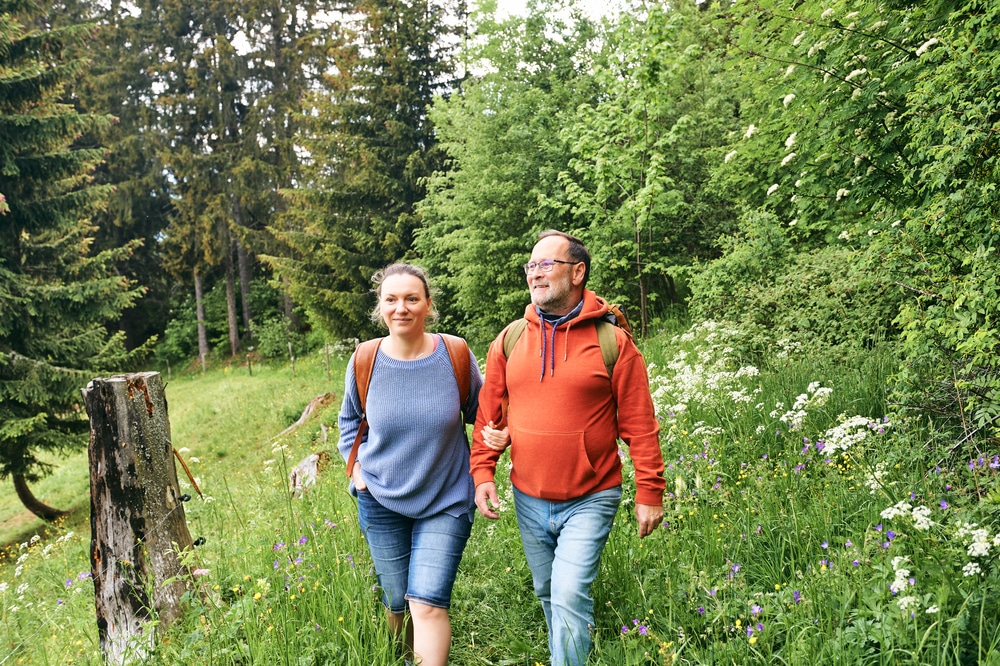 Things to Do in McHenry, MD, a happy couple hiking in the woods