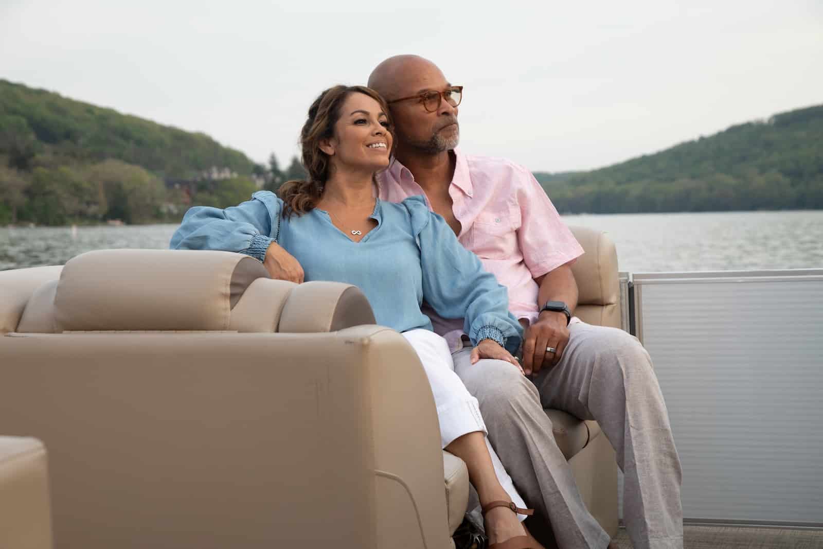 Happy couple on at boat ride on the lake, one of the best things to do at Deep Creek Lake 