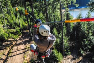 Woman on zipline at Wisp Resort
