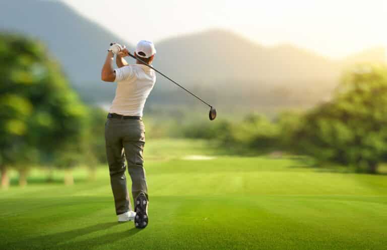 Golfer drives ball down the fairway at Wisp Resort Golf Course.